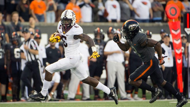 Minnesota Golden wide receiver Chris Autman-Bell (3) runs past Oregon State safety Brandon Arnold (3) for a touchdown reception during the first quarter Sept. 9 at Reser Stadium. Minnesota won the game 48-14.
