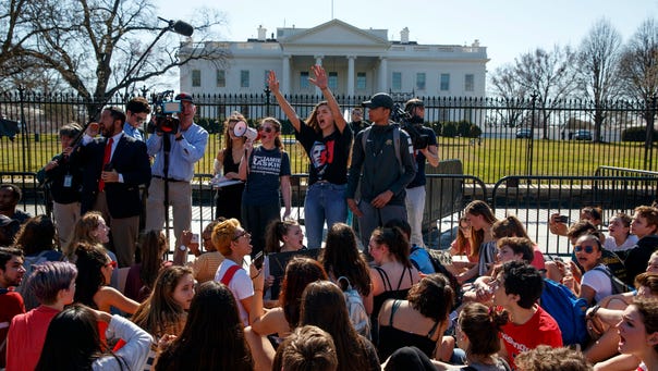 Demonstrators take part in a student protest for gun