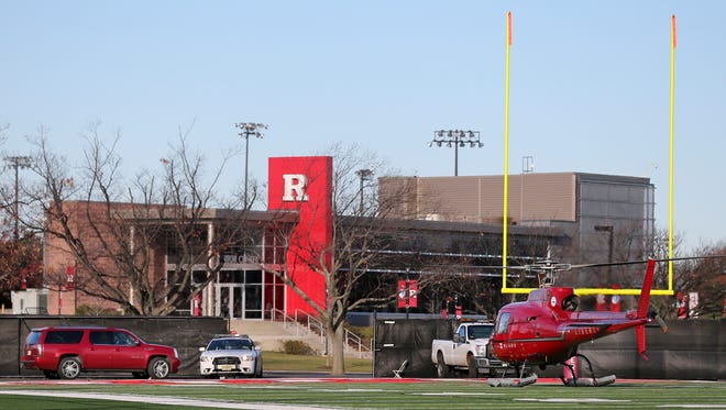 After being fired over the phone while out recruiting, Kyle Flood landed on the  Rutgers football practice field in a school-contracted helicopter.