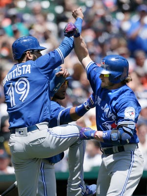 Josh Donaldson is greeted by Jose Bautista after hitting a three-run homer in the third inning Wednesday.