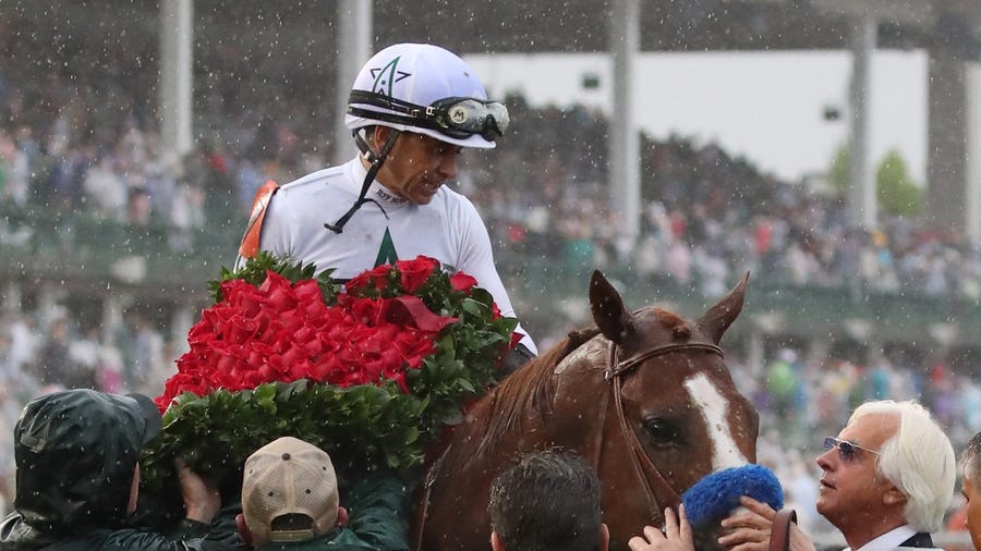 May 5, 2018; Louisville, KY, USA; Mike Smith aboard Justify (7) with trainer Bob Baffert in the winner's circle after winning the 144th running of the Kentucky Derby at Churchill Downs. Mandatory Credit: Mark Zerof-USA TODAY Sports