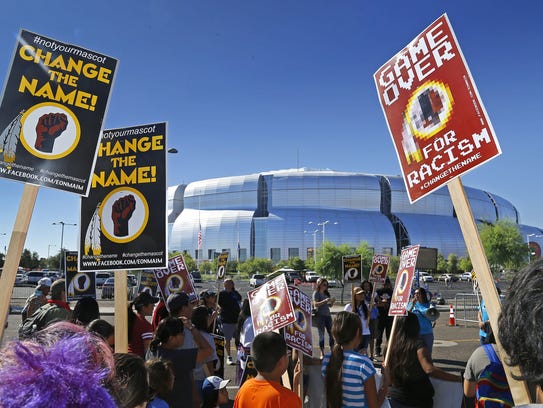Protesters who claim "Redskins" is a slur and want