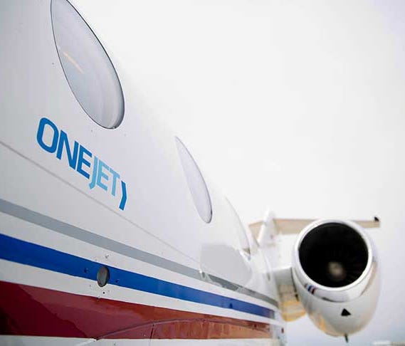 This photo provided by OneJet shows the exterior of one of its 7-seat Hawker 400XP jets.