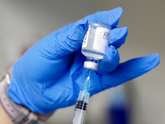 A flu vaccination being given at the Wayne County Health department clinic.