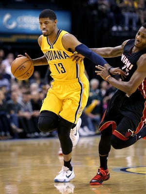 Indiana Pacers forward Paul George (13) is called for a foul on Miami Heat guard Mario Chalmers (15) in the second half of their game Sunday, April 5, 2015, evening at Bankers Life Fieldhouse. The Pacers defeated the Heat 112-89.