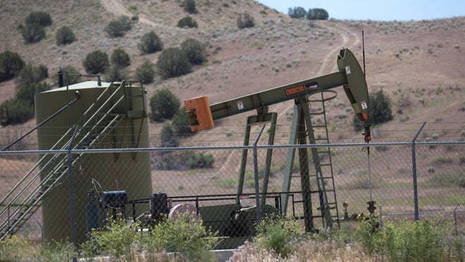 A pumpjack operates in Farmington. State sales of oil and gas leases on state lands are skyrocketing, a direct contrast to activity in San Juan County on federally-controlled lands.