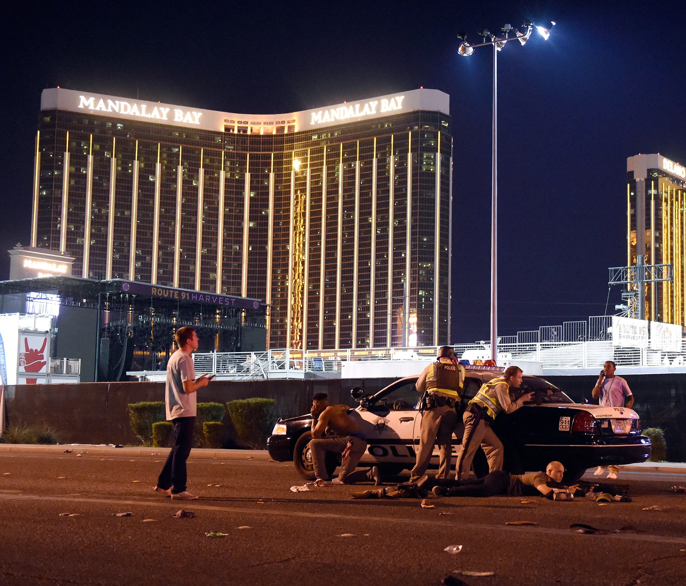 Las Vegas police stand guard along the streets outside the festival grounds of the Route 91 Harvest.