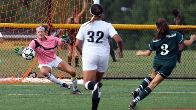 South Brunswick goalie Sydney Schneider can't reach the shot on goal by East Brunswick's Gina Morrison (3) on Tuesday.