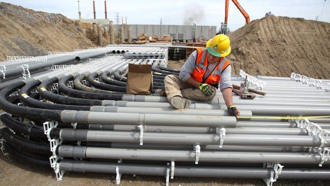 April 18, 2016 &#8212; A construction worker connects conduit that will feed electricity from the main power generator to the rest of the plant at the Tennessee Valley Authority's new $975 million natural gas-fired electrical generating plant under construction in the Frank C. Pidgeon Industrial Park. (Mike Brown/The Commercial Appeal)
