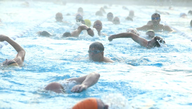 Hundreds of athletes participate in the annual Asheville Triathlon at Rec Park Pool. The event is this Sunday morning.