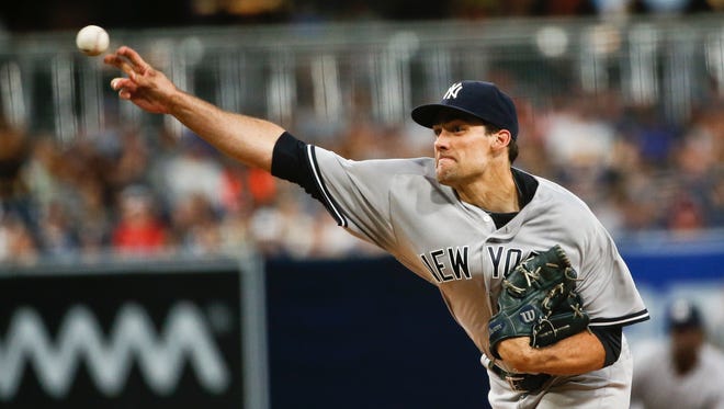 New York Yankees starting pitcher Nathan Eovaldi works against the San Diego Padres during the first inning of a baseball game Friday, July 1, 2016, in San Diego.