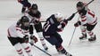 United States forward Hilary Knight goes for the puck