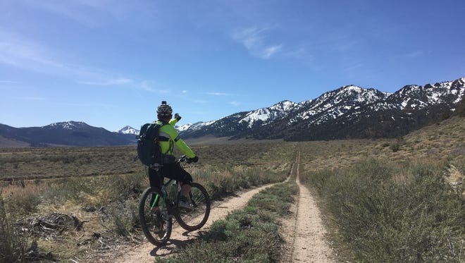 Trevor Oxborrow of Washoe Valley, Nev., ground proofs a section of the Reno-to-Las Vegas backcountry bike route he identified. The section is in Slinkard Valley, Calif., south of Gardnerville, Nev.