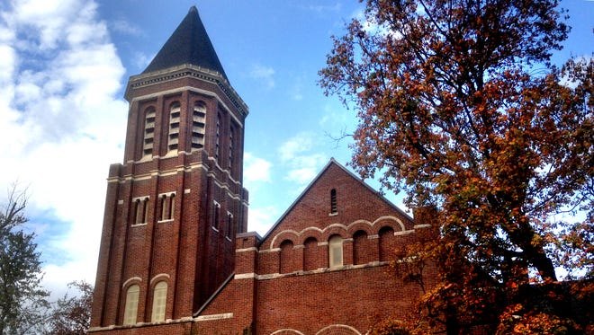 The former First United Methodist Church with a bell tower on the left side sits on College Street a block north of the Square in Murfreesboro. The building dates back to 1888.