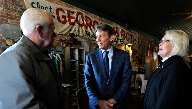 Randy Boyd, center, and his wife, Jenny, right, mingle with Fred Boyd during a small gathering to promote his run for governor at the J.O. Boyd General Merchandise Store in Fruitvale, Tenn., on March 15, 2017. Randy Boyd is a descendant of the Boyds of Fruitvale.