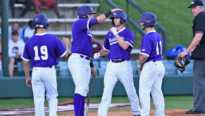 Tyler Smith (center) was the hero Sunday for Northwestern State.