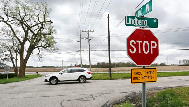 A car passes through the intersection of Lindberg Road and County Road 400 West Thursday, May 3, 2018, in rural West Lafayette. Purdue student Lucas B. Shanker died of injuries he suffered Tuesday when he disregarded a stop sign at the intersection and was struck by a truck.