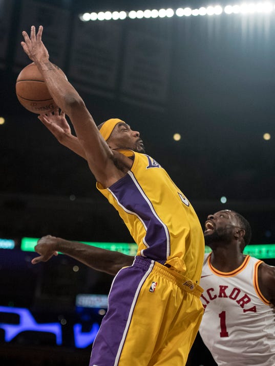 Los Angeles Lakers forward Corey Brewer, left, tries to catch a rebound over Indiana Pacers guard Lance Stephenson during the second half of an NBA basketball game Friday, Jan. 19, 2018, in Los Angeles. (AP Photo/Kyusung Gong)