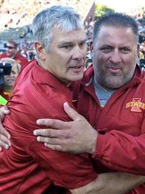 Iowa State head coach Paul Rhoads, left, celebrated after their 20 - 17 win over Iowa in football game played at Kinnick Stadium in Iowa City on Saturday Sept. 13, 2014.