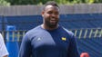 Michigan defensive lineman Maurice Hurst looks on as