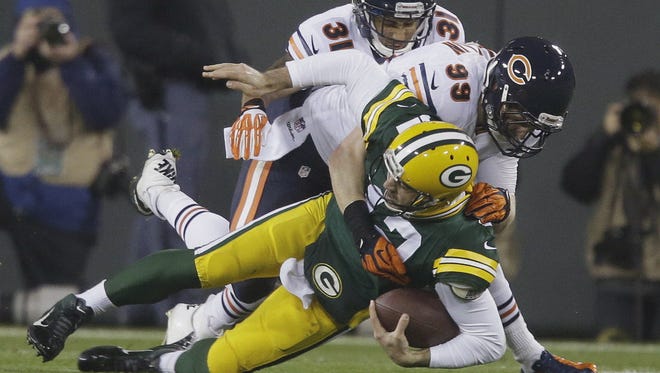 Aaron Rodgers is knocked out of the game with a broken collarbone on a sack by Bears defensive end Shea McClellin on Nov. 4, 2013.