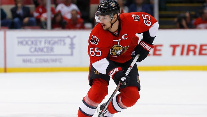 Ottawa Senators defenseman Erik Karlsson (65) carries the puck against the Detroit Red Wings in the first period of an NHL hockey game Friday, Oct. 30, 2015 in Detroit. (AP Photo/Paul Sancya)