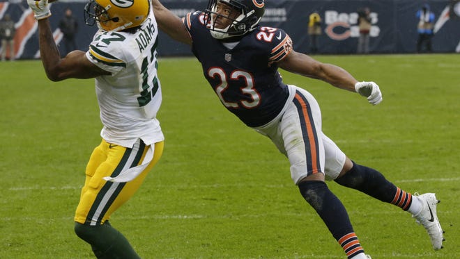 Green Bay Packers receiver Davante Adams (17) reels in a 19-yard touchdown pass while being covered by Chicago Bears cornerback Kyle Fuller (23) during the fourth quarter on November 12, 2017, at Soldier Field in Chicago.