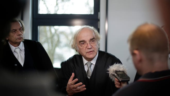 Thomas Walter, attorney of Auschwitz survivors, who have joined the trial against former SS medic Hubert Zafke talks to media during a break at the court in Neubrandenburg, about 120 kilometer (75 miles) north of Berlin, Germany, Monday, Feb. 29, 2016.