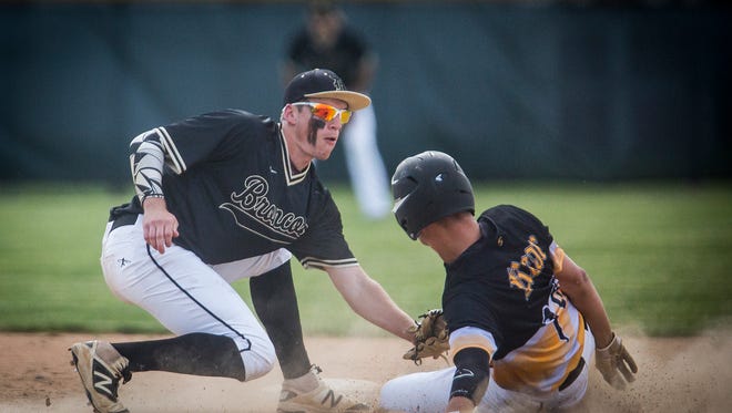 Daleville's TJ Price tags for an out at second against Cowan during their sectional game at Daleville High School Thursday, May 26, 2016. Daleville travels to the Class A Carroll (Flora) Regional Saturday to play Turkey Run.