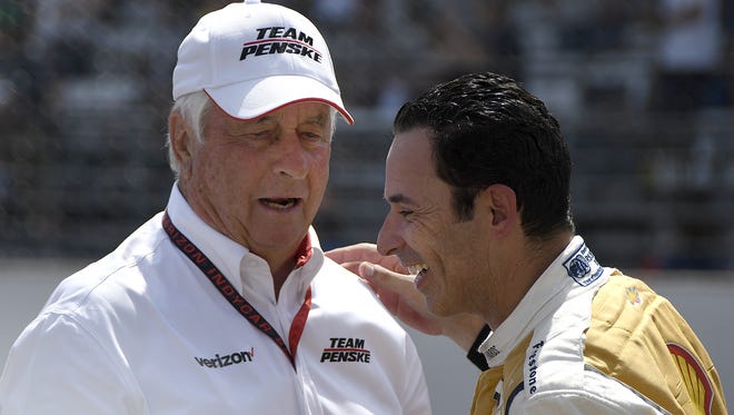 Team Penske IndyCar driver Helio Castroneves (3) talks with his boss Roger Penske following the 101st running of the Indianapolis 500 at Indianapolis Motor Speedway Sunday, May 28, 2017.