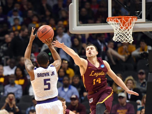 Loyola Ramblers guard Ben Richardson (14) defends a