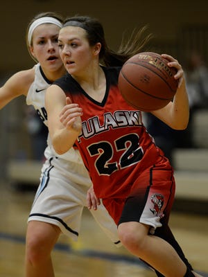 Pulaski’s Mariah Szymanski (22) gets around Bay Port’s Jamie Hebel during a Fox River Classic Conference game. Szymanski earned first-team all-state honors from the coaches.