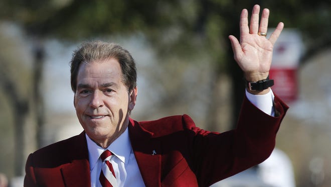 Alabama's coach Nick Saban waves to fans as he parades down the street during the NCAA college football national championship parade, Saturday, Jan. 20, 2018, in Tuscaloosa, Ala. Alabama won the national championship game against Georgia 26-23 in overtime. (AP Photo/Brynn Anderson) ORG XMIT: ALBA103