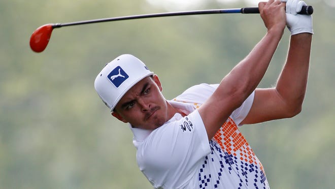 
Rickie Fowler watches his tee shot on the first hole during the first round of the PGA Championship golf tournament at Valhalla Golf Club on Thursday, Aug. 7, 2014, in Louisville, Ky.
