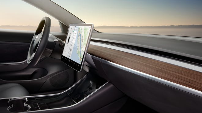 The Tesla Model 3's infotainment screen replaces analogy buttons with digital controls.
