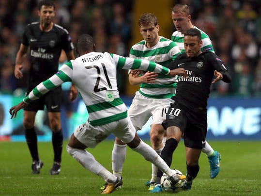 Celtic's Olivier Ntcham, front, and PSG's Neymar, right, challenge for the ball during the Champions League Group B soccer match between Celtic and Paris St. Germain at the Celtic Park stadium in Glasgow, Scotland, Tuesday, Sept. 12, 2017. (AP Photo/Scott Heppell)