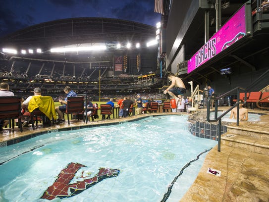 Reed Interdonato, 14, jumps into the Chase Field pool