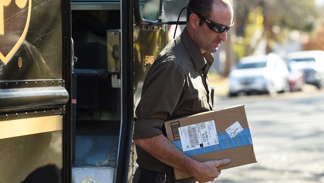 UPS driver Loyal Schmidt delivers an Amazon package on Monday, November 7, 2016. The city of Fort Collins recently started collecting sales tax revenue from all Amazon purchases by city residents.