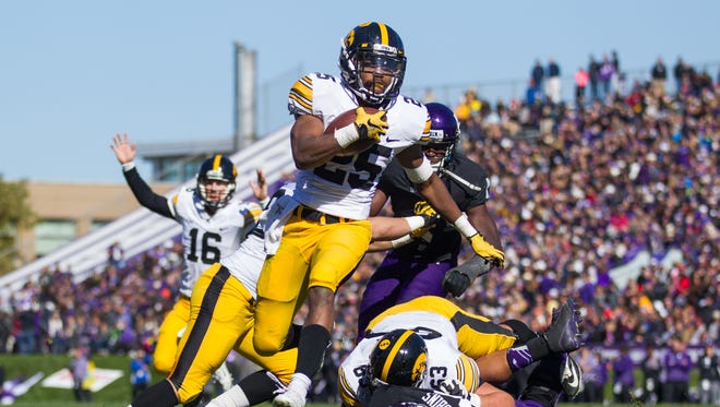 University of Iowa running back Akrum Wadley (25) rushes for a touchdown in the third quarter of a NCAA Division I Football game between Northwestern University and the University of Iowa at Ryan Field on October 17, 2015 in Evanston, Illinois.