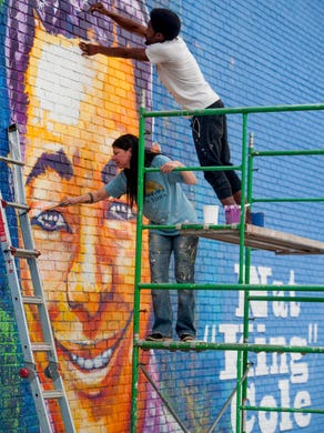 Nat King Cole Mural Smiles Over City