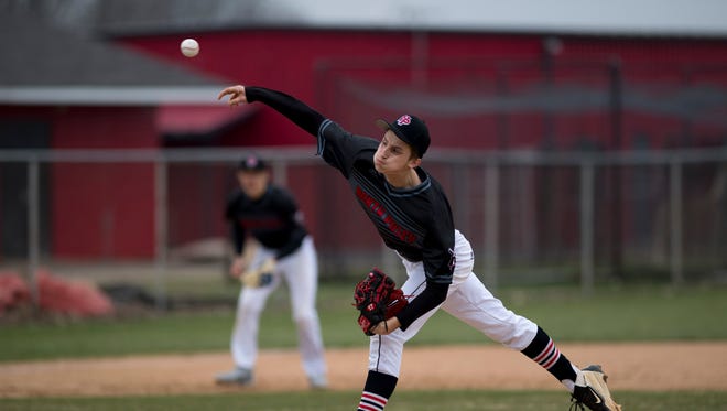 North Posey's Shane Harris (17) delivers a pitch against the Carmi Bulldogs at North Posey High School Monday afternoon. North Posey got the win by beating Carmi 2-1.
