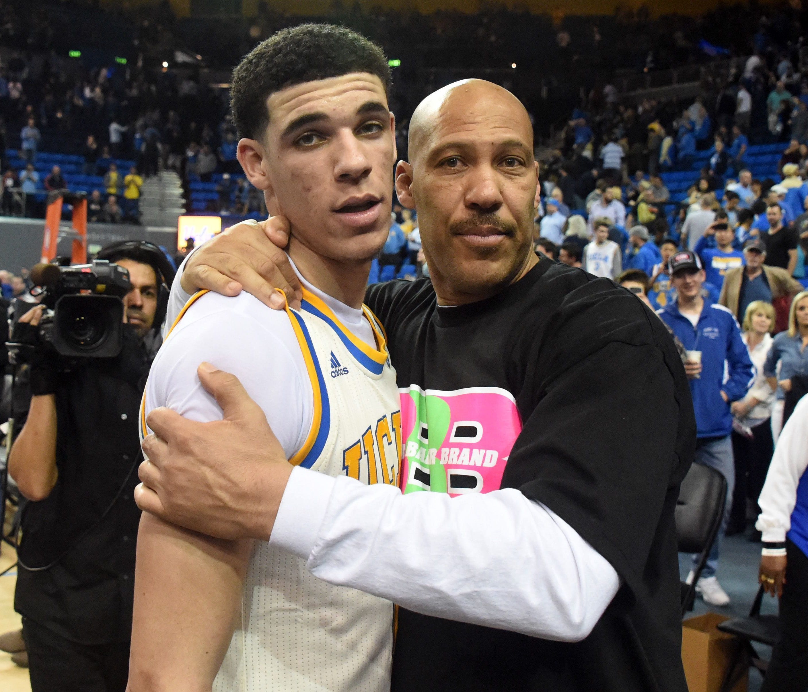 Lavar Ball embraces his son Lonzo after a game against Washington State.