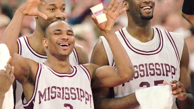 Mississippi State University basketball team members Erick Dampier, Marcus Bullard, Darryl Wilson, and Russell Walters celebrate after a 1996 victory.