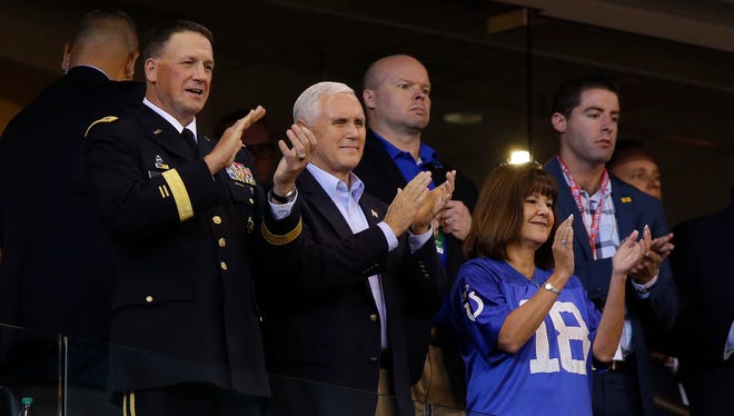 Vice President Mike Pence applauds before an NFL football game between the Indianapolis Colts and the San Francisco 49ers, Sunday, Oct. 8, 2017, in Indianapolis. (AP Photo/Michael Conroy)