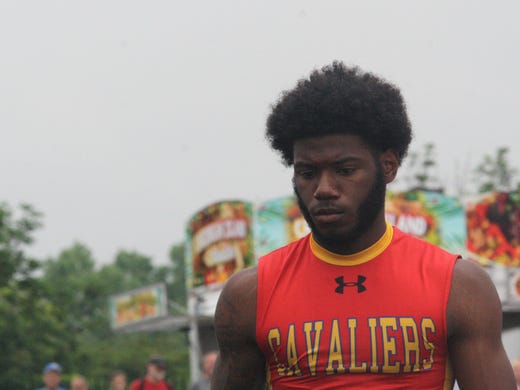 Purcell Marian's Torrance Johnson gets ready to run
