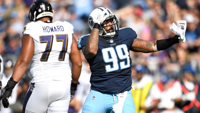 Titans defensive tackle Jurrell Casey (99) celebrates his sack of Ravens quarterback Joe Flacco (not shown) during the first half Sunday.