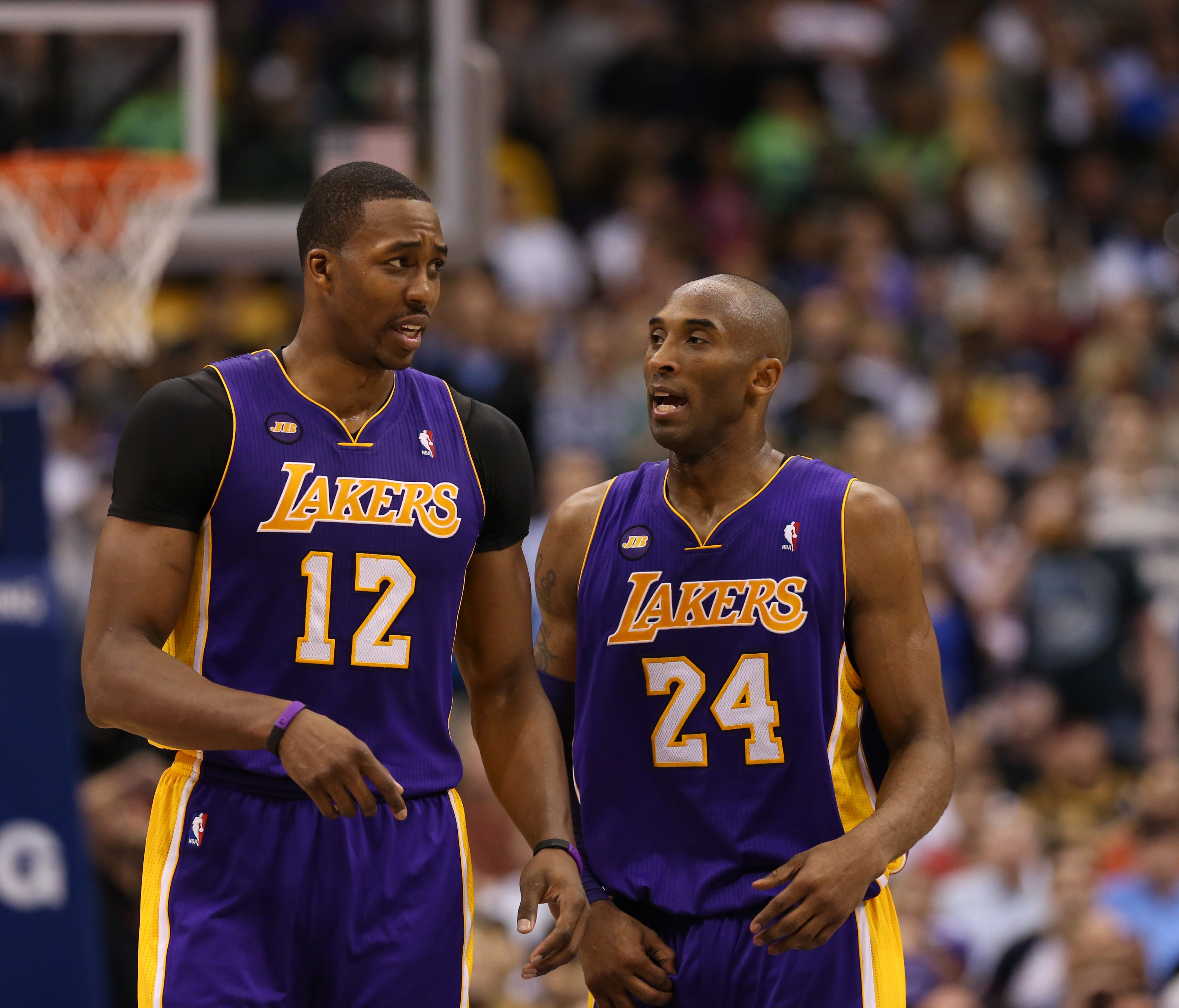 Los Angeles Lakers guard Kobe Bryant speaks with center Dwight Howard during a game against the Dallas Mavericks.