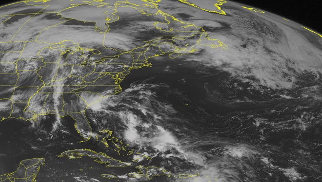 This NOAA satellite image taken Saturday, May 28, 2016 at 9:45 AM EDT shows Tropical Depression Two continuing to move northwest towards the North and South Carolina coastline as it is expected to slightly strengthen into a weak tropical storm before making landfall.