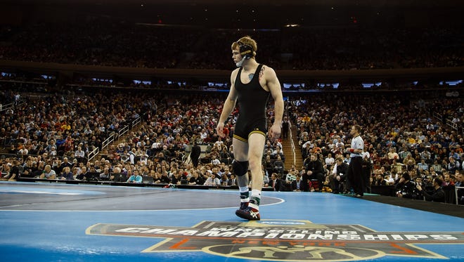 Iowa's Brandon Sorensen walks onto the matt before wrestling Penn State's Zain Retherford for their NCAA championship bout on Saturday, March 19, 2016 in New York City. Retherford would go on to win 10-1.