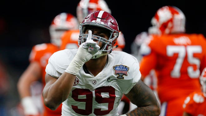 Alabama defensive lineman Raekwon Davis (99) gestures after a stop in the first half of the Sugar Bowl semi-final playoff game against Clemson for the NCAA college football national championship, in New Orleans, Monday, Jan. 1, 2018. (AP Photo/Butch Dill)